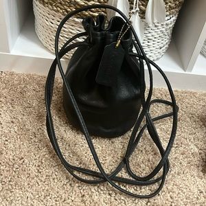 Vintage Coach black leather mini drawstring “Littleton”. Very hard to find.